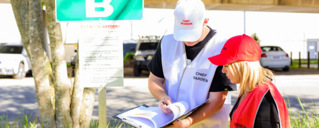 Fire Warden and Chief Fire Warden Training outside and an assembly point going through a checklist