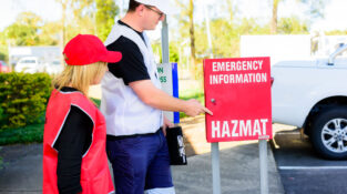 Fire Safety Advisor Re-certification showing a chief warden and a fire warden at an emergency information point