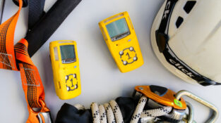 Gas Testing Atmospheres training showing ropes, harness, a helmet and gas test monitors